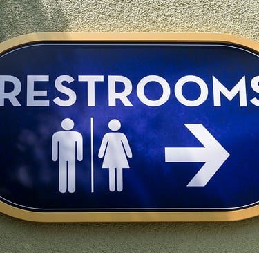 a blue sign with a man and woman restroom sign