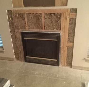 a fireplace with a fireplace in the middle of a room