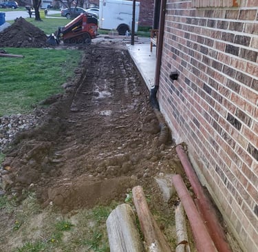 a brick wall and a fire hydrant in a yard