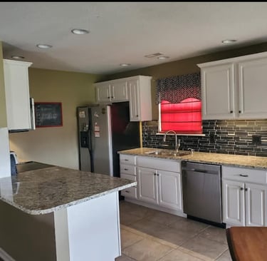a kitchen with a table and chairs and a table