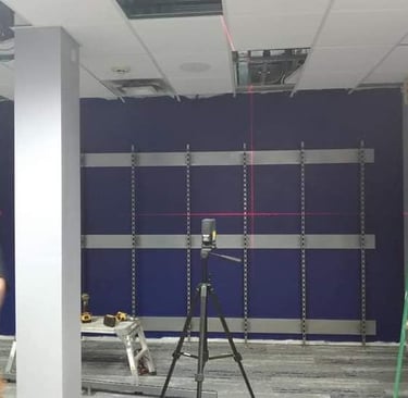 a man standing on a ladder ladder to get a picture of a man in a