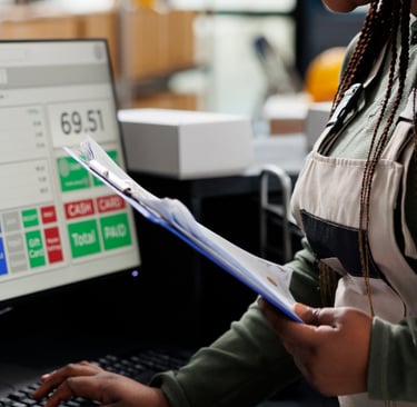 woman using computer tracking inventory