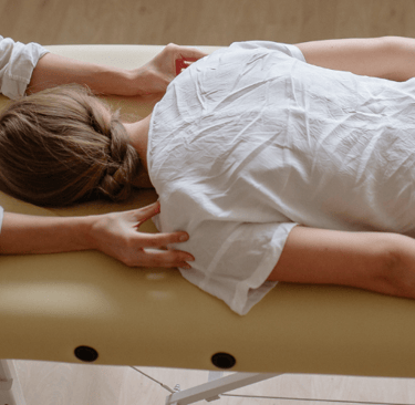 a woman at the chiropractor on a table