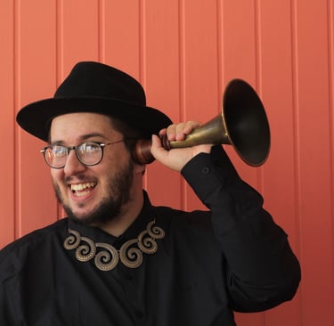 a man in a black hat and a black hat with a horn horn horn