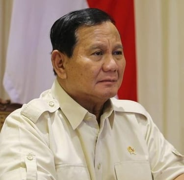 a man in a military uniform sitting at a table