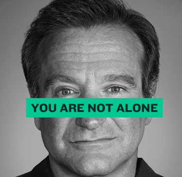 Cayla Henri Wax Melts: A man with a green banner over his face "You are not alone"