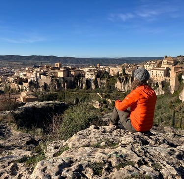 inspirella sitting on the rocks, overlooking Cuenca in Spain