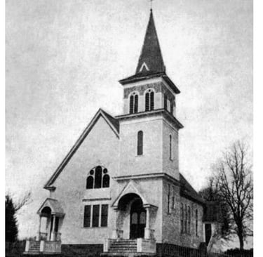 black and white photo of a church with a steeple