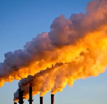 a large amount of smoke coming out of a chimney