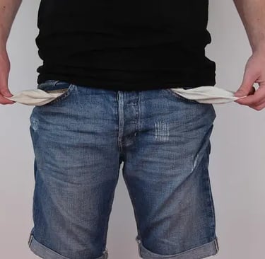 a man in a black shirt and jeans shorts