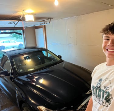 Vehicle exterior waxed and buffed for long-lasting gloss.