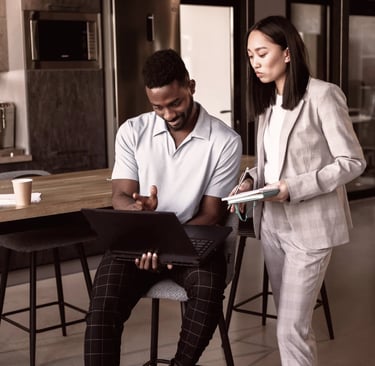 a man and woman standing in a office