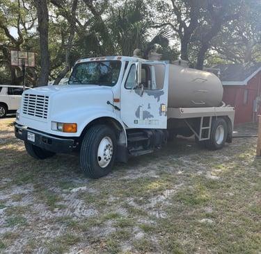 a pump truck pulled up to a home for service