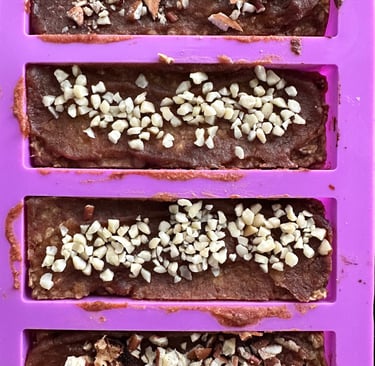 Delicious oat bars with date caramel sauce and chopped almonds
