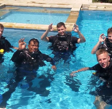 Students practicing diving skills in pool at Lovina Reef with instructor, Sunrise Dive Bali