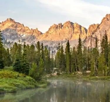 Mountains with a lake and pine trees in Idaho.