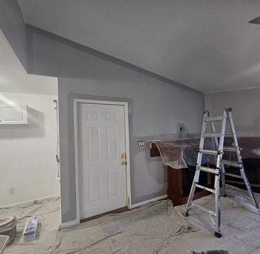 an interior room painted with a ladder