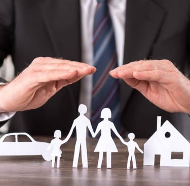 a man in a suit and tie is holding hands in front of a paper cut