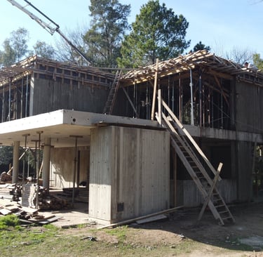 a house being built into a house with a ladder