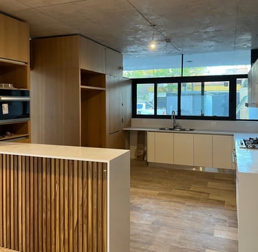 a kitchen with a wooden counter top and a wooden counter top