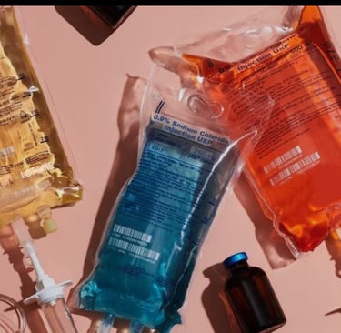 Three IV therapy bags containing blends of vitamins, minerals and amino acids
