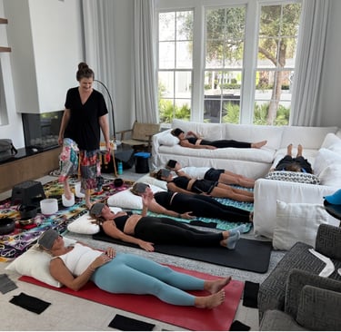 A group of women in a soundbath class.