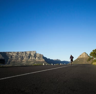 a person riding a skateboard down a hill