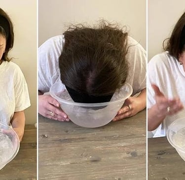 Person nedsænker ansigtet i en balje med iskoldt vand i cirka 15 sekunder