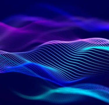 a colorful abstract background with a blue and purple wave of light