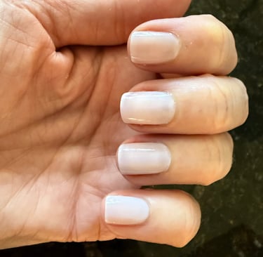 Two coats of sheer nail polish giving a clean, natural, healthy looking finish on the nails.