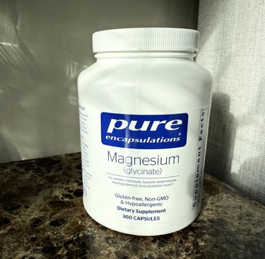 Bottle of magnesium glycinate on an end table ready for a relaxing nighttime routine