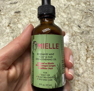 Mielle rosemary mint hair oil for scalp nourishment and natural hair growth