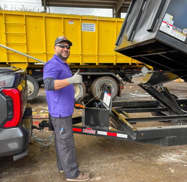 A smiling worker giving a thumbs up after a junk removal job in Portland