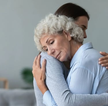 Abrazo de familiares tras el duelo de un ser querido fallecido.