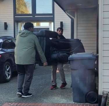 Best affordable reliable movers in Edmonton lifting furniture couch. Fast efficient movers delivery
