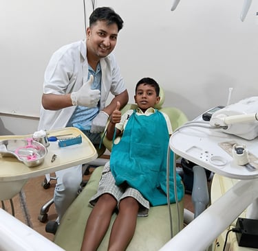 Dr Barun Kant dentist with child after dental treatment at Rps Dental Clinic in Ranchi