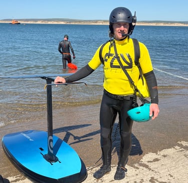 Instructor standing on the slipway with radio headset and high vis vest