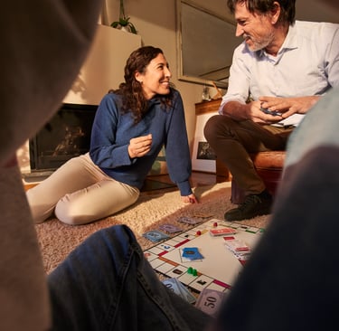 a man and woman playing a board game