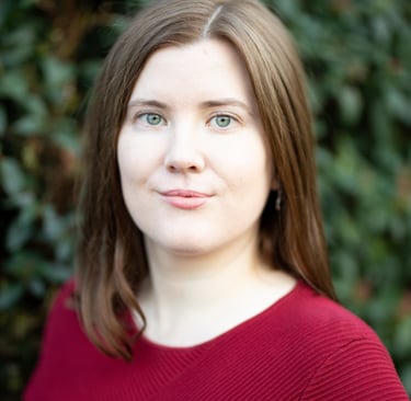 Adept Mediation professional compassionate female mediator looking at a client