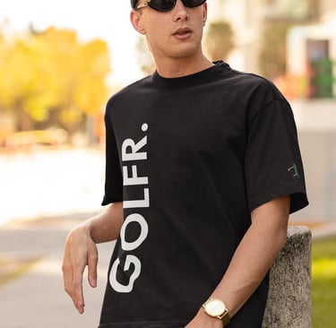 a man in a black shirt and sunglasses