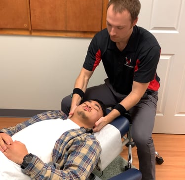 Dr. Frost giving a chiropractic neck adjustment for a patient in Royal Palm Beach