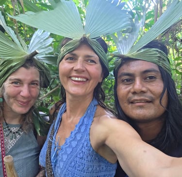 three people standing in front of a forest