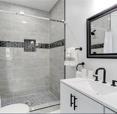 Completed bathroom remodel in Norfolk with new tile, fixtures, and lighting