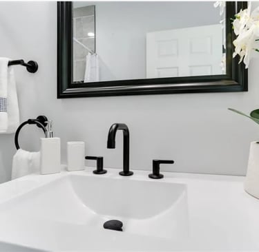 Modern bathroom vanity with matte black fixtures and added storage
