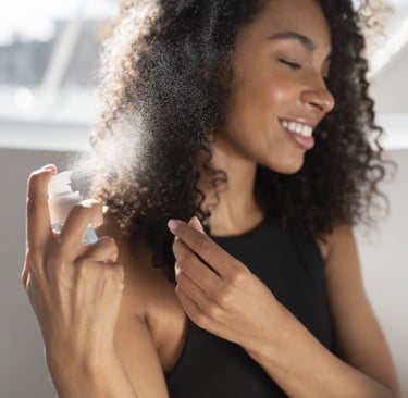 spritzing your hair with hair mists