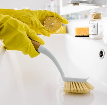 using lemon juice and baking soda to clean the bathroom