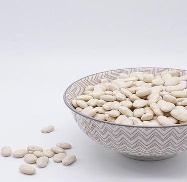White Beans in a cup and on the table