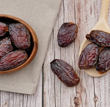 Dates in a bowl and on the table
