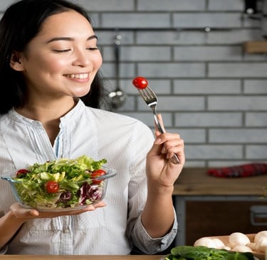 A girl eating salad