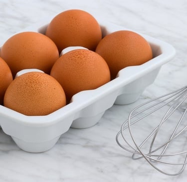 Eggs in a tray with a whisker